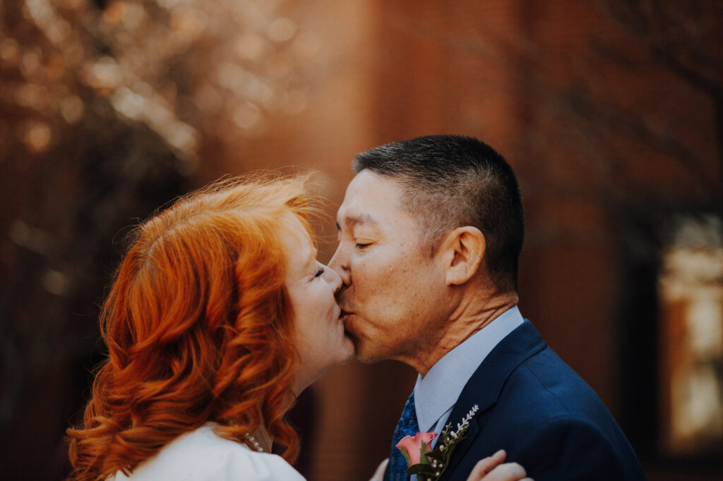 Couples' first kiss Downtown Frederick Elopement