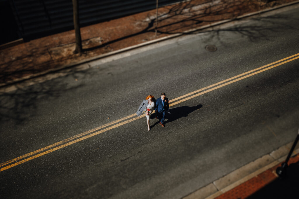 Couple walks across street after Downtown Frederick Elopement