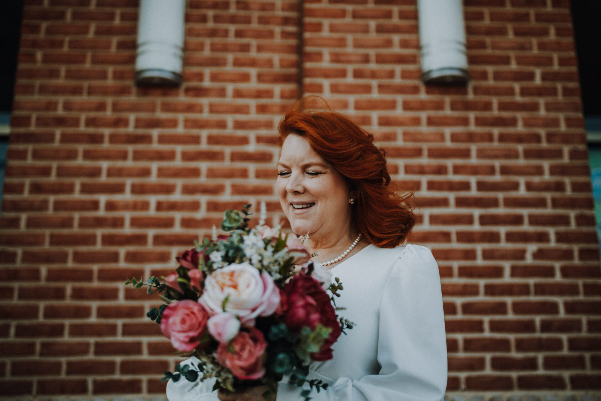 Bride smiling with flowers